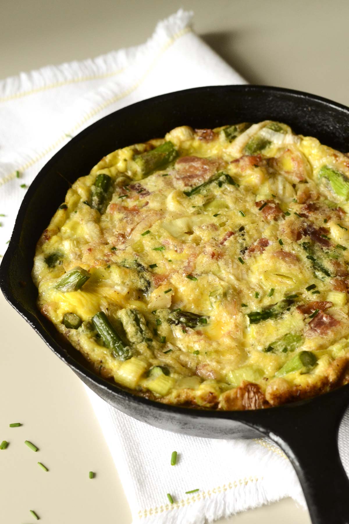 This Asparagus Leek Frittata is a delicious celebration of spring vegetables. Great recipe for breakfast, lunch, or dinner!