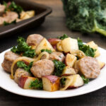 Sheet pan sausage and veggies on a plate