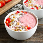 Strawberry banana smoothie bowls with toppings