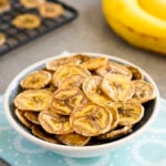 Dried banana chips in a small bowl