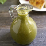 Homemade basil oil in a jar