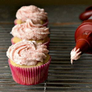 strawberry cupcakes on a cooling rack
