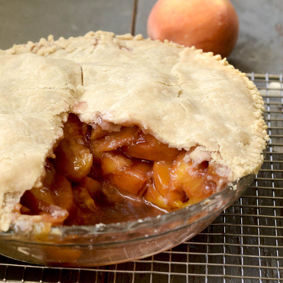 Vegan peach pie with maple syrup in a pie pan