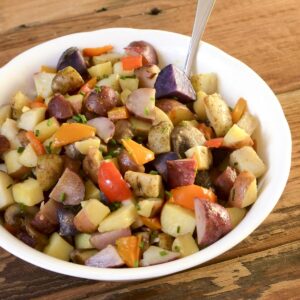 Oven roasted potatoes and peppers in a bowl