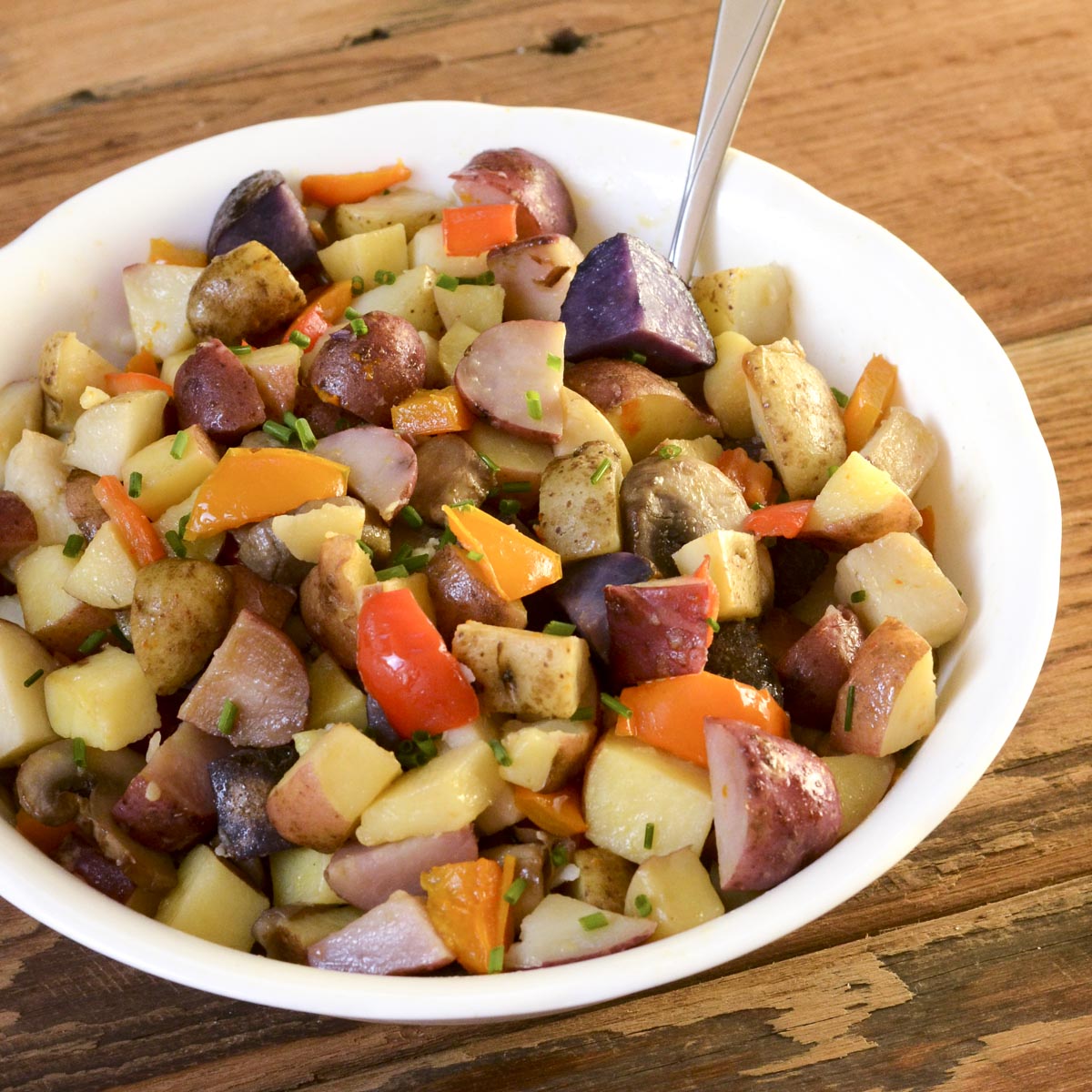 Oven roasted potatoes and peppers in a bowl